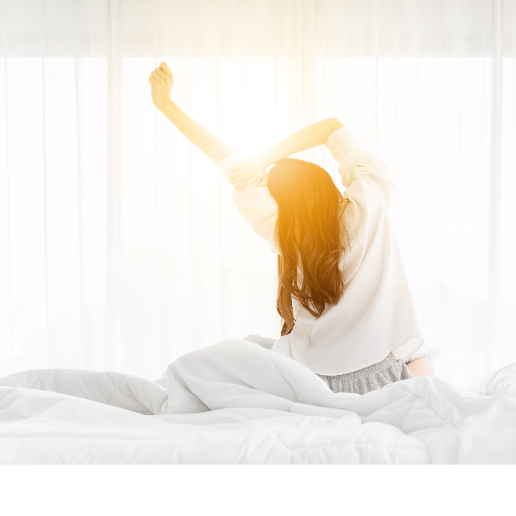 Woman stretching as she wakes in the morning