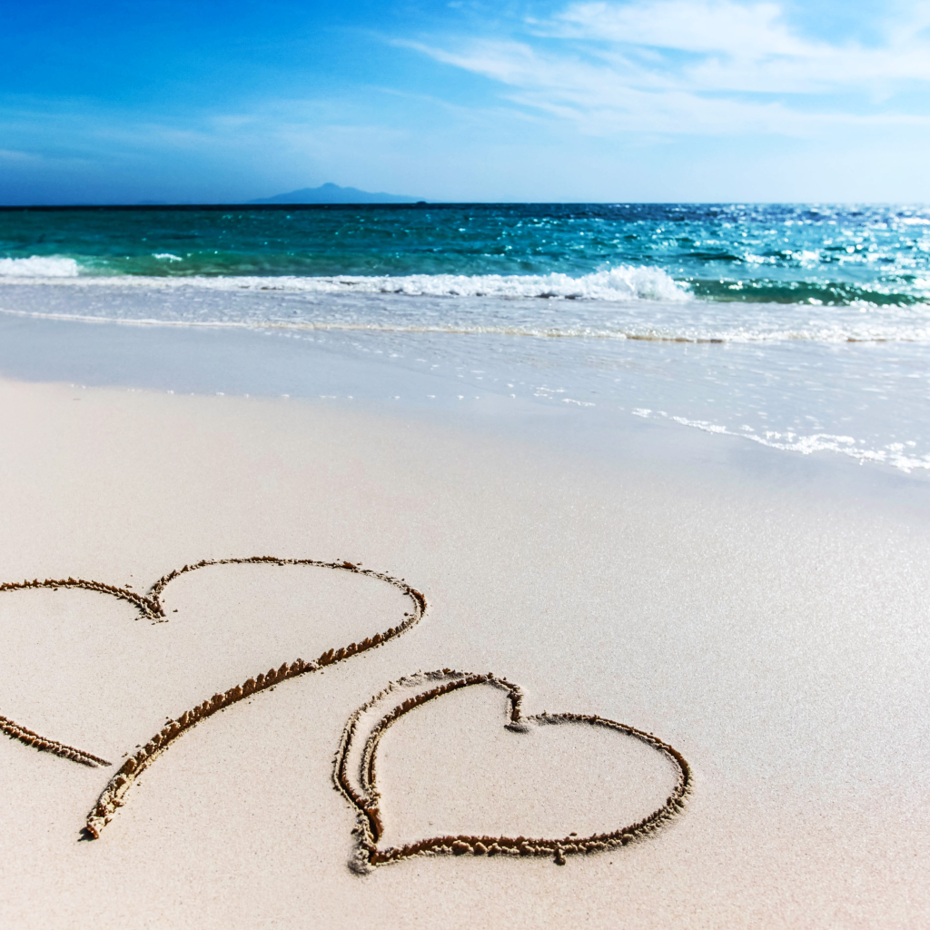 2 hearts drawn in the sand
